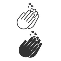 Obraz premium Two clapping hands for applause with a heart of gratitude coming out of them.