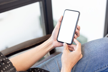 cell phone blank white screen mockup.hand holding texting using mobile on desk at office.background empty space for advertise.work people contact marketing business,technology