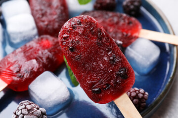 Tasty blackberry ice pops, closeup. Fruit popsicle