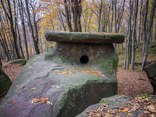 Russia, Caucasus, Tuapse district, dolmen on the mountainside on a cloudy autumn day.
