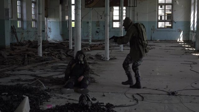 stalker in the destroyed building sees the dead body of another stalker. The concept of post-apocalypse and survival after a nuclear war