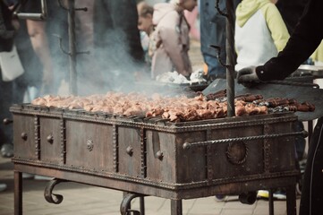 Cooking of roasted meat in open air at street festival