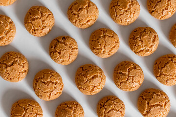 homemade cookies with cracks on a white background pattern