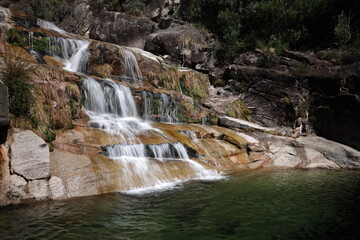 Obraz premium A view of the Cascata Fecha de Barjas waterfalls in the Peneda-Geres National Park in Portugal