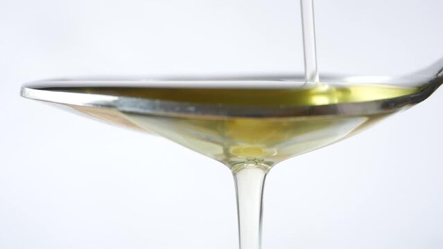  slow motion of Pouring vegetable oi in a spoon 