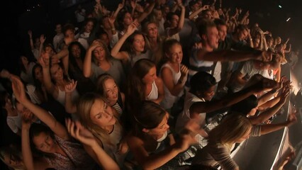 Crowd, concert and music festival, party and dance, jumping and social nightclub, edm youth culture and rave show. Top view of happy audience, fans and disco performance, band, dj event and dancing - Powered by Adobe