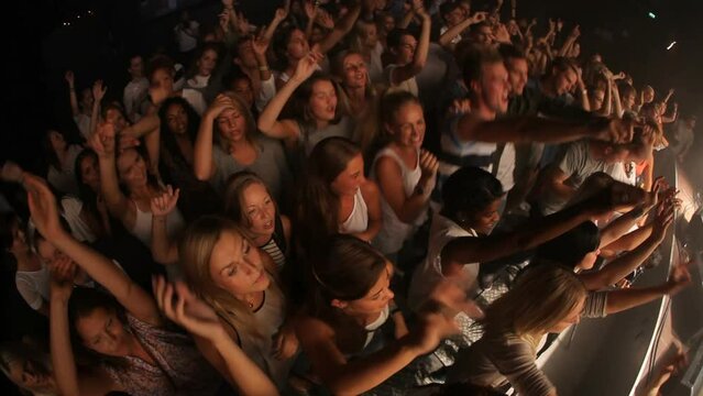 Crowd, concert and music festival, party and dance, jumping and social nightclub, edm youth culture and rave show. Top view of happy audience, fans and disco performance, band, dj event and dancing