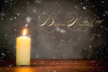 Merry Christmas.Candle lit in a rustic atmosphere and snow effect. Text written in Italian