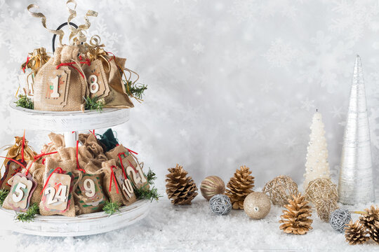 A homemade Advent calendar surrounded by festive decorations.