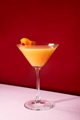 Vodka with orange juice cocktail garnished with orange peel