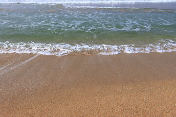 Waves on Shore of Tropical White Sand Beach on a Sunny Day