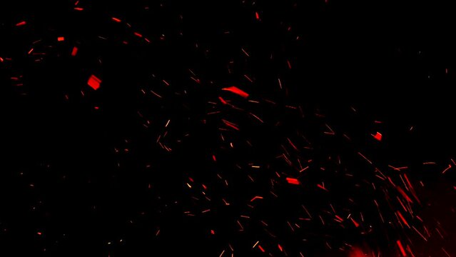 A burning firestorm inferno with hot ember ash flying into the black night sky. Real footage great to use as an overlay texture