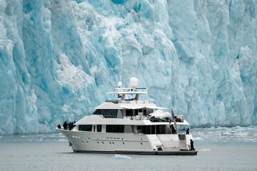 Luxury yacht next to glacier in Alaska
