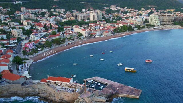 Aerial video. The city of Petrovac a coastal city on Adriatic sea. Travel to Montenegro concept