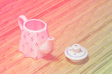 still life classic ceramic kettle on mat