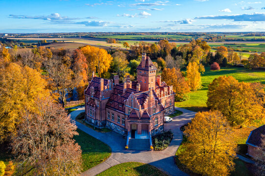 Jaunmoku Brick Medieval Castle Near Tukums, Latvia on a clear sunny autumn day, drone view