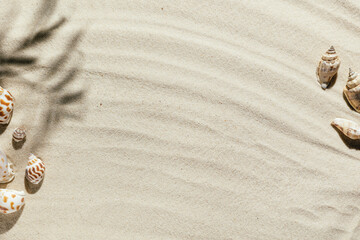 Background of light beach sand with space for text.