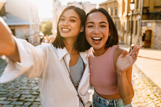 Selfie Of Two Young Beautiful Happy Smiling Asian Girls