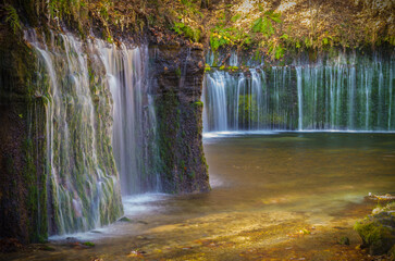 Waterfall which multiple streaks of water drape