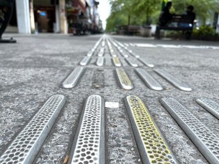 Blind track in a shape of tactile pattern paving block used for blind people.