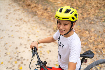 Happy teenage boy on bike