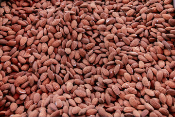 Heap of peeled almonds. Background of large raw peeled almonds. Close-up.