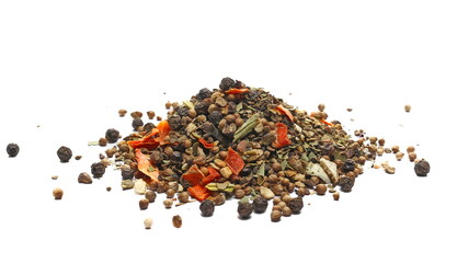 Mixture of spices with dried vegetables and lemon and orange peel, allspice, black pepper, coriander, bay leaf, carrot, parsnip, clove, ginger, leek, onion, parsley, paprika isolated on white, side 