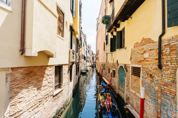 Gondola in a narrow Venetian canal