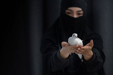 Beautiful Arabian woman in black Hijab, scarf and black veil, or Niqab Muslim traditional dress,...
