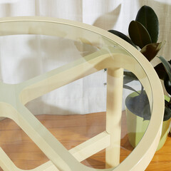 Vintage retro 1970s off-white dining table. Space age 1970s cream dinette table. Closeup view of a...