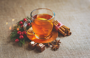 Lemon tea in glass cup on christmas background