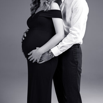 pregnant woman with her husband, black and white photo