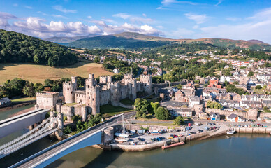 Fototapeta na wymiar Aerial view with Conwy town and the medieval castle, the famous landmark of Wales and UK, captured in the morning