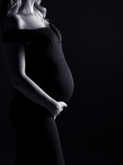 pregnancy woman holding belly, pregnant silhouette, black and white photo