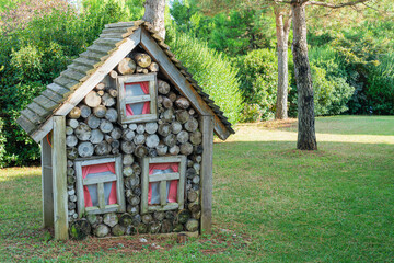 decorative house made of firewood in the park