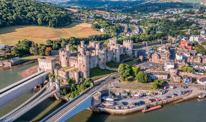 Fototapeta na wymiar Aerial view with Conwy town and the medieval castle, the famous landmark of Wales and UK, captured in the morning