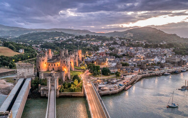Aerial view with Conwy town and the medieval castle, the famous landmark of Wales and UK, captured...