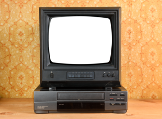 Old black vintage TV with white screen and VCR on wallpaper background.