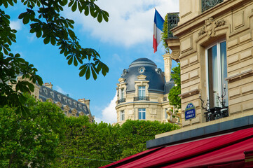 A view looking up from Avenue George V in Paris, France.