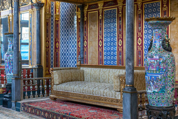 The magnificent chambers of the Sultan in the Ottoman palace with a sofa in an interior decorated...