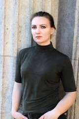 portrait of a young woman with ponytail in a turtleneck