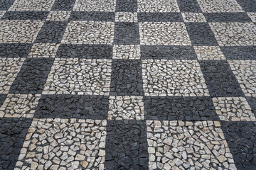 black and white checkered decorated pavement of street, Funchal, Madeira
