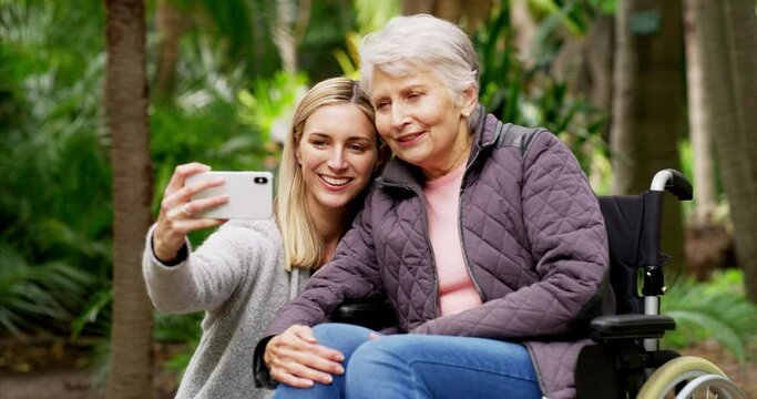 Senior woman, daughter and selfie at outdoor park with elderly in wheelchair for rehabilitation and air with hospice or caregiver. Adult. child and old mother together with phone for picture in UK