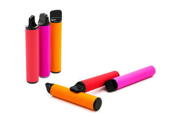 Set of colorful disposable electronic cigarettes isolated on white background. The concept of modern smoking, vaping and nicotine.	