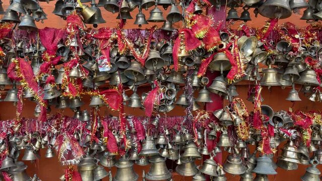 Of bells hanging in Maa Naina Devi Hindu temple with red ribbons, Nainital