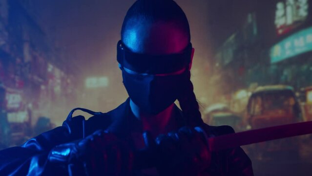 Cyberpunk ninja girl in a mask and with a katana. Beautiful samurai woman on the background of Asian city downtown.