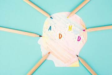 ADHD, attention deficit hyperactivity disorder, mental health, colored paper with pencils

