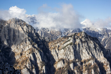 Julian Alps Slovenia, peak Debela Pec 2014 m, winter hiking in Triglav with snowy peaks and mist 