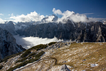 Julian Alps Slovenia, peak Debela Pec 2014 m, winter hiking in Triglav with snowy peaks and mist 