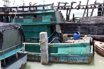 Fototapeta na wymiar Peaceful Summer Holidays , Fisherman Boat Docked at the harbour